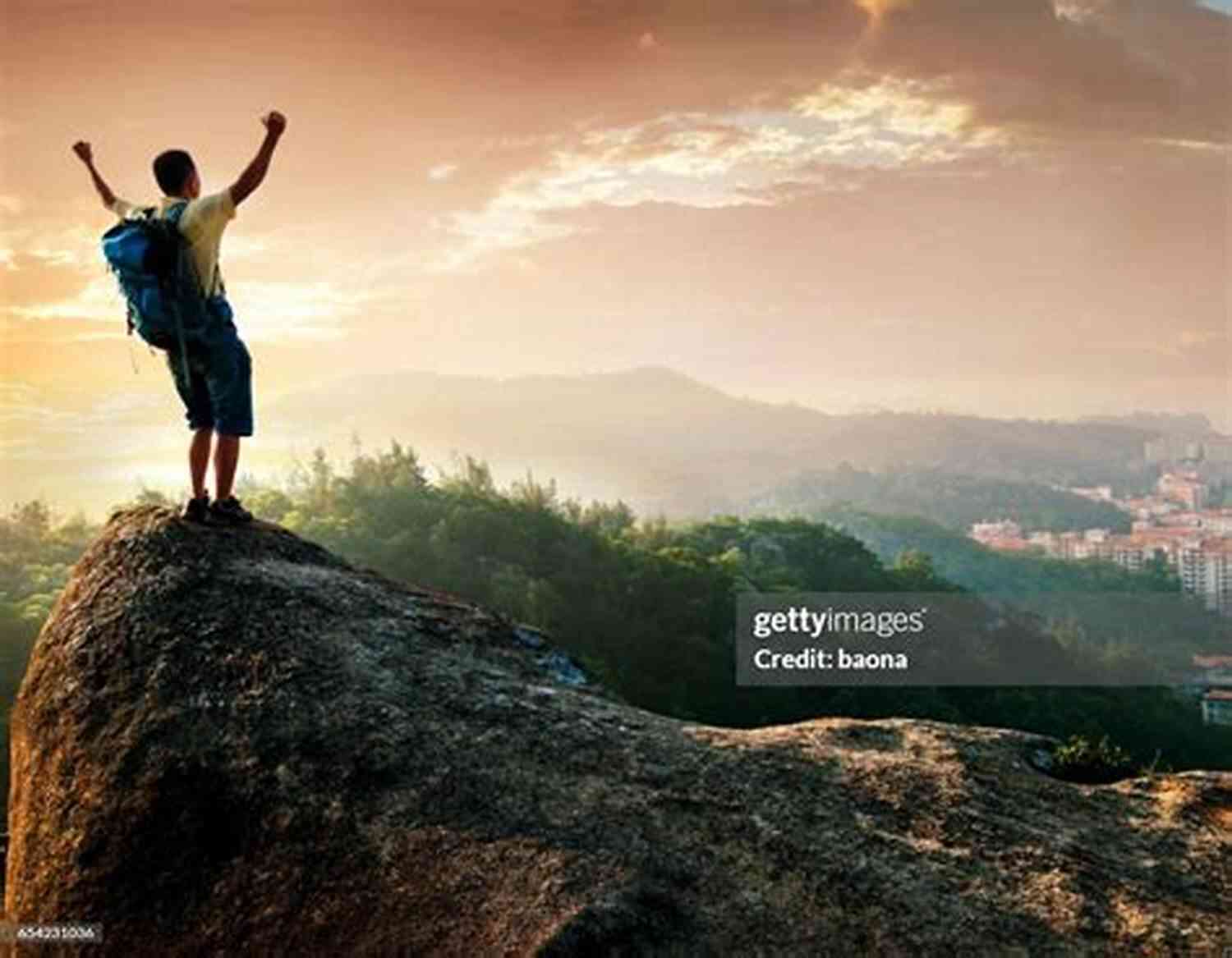 Man Standing On A Mountain Peak, Symbolizing Success And Achievement The ROAD M A P To Total Success